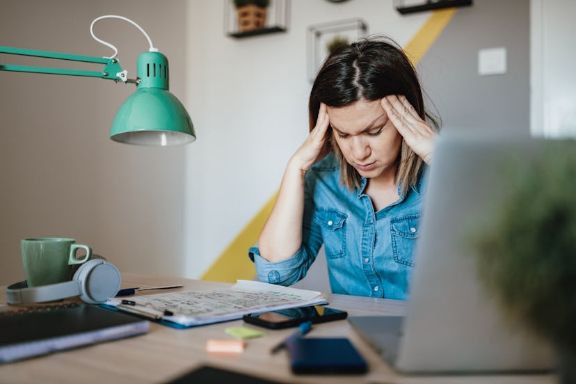 A woman looks stressed at work. Stress can change the menstrual cycle, experts say. 
