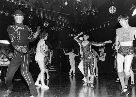 A group of people dancing in a photo taken in Studio 54