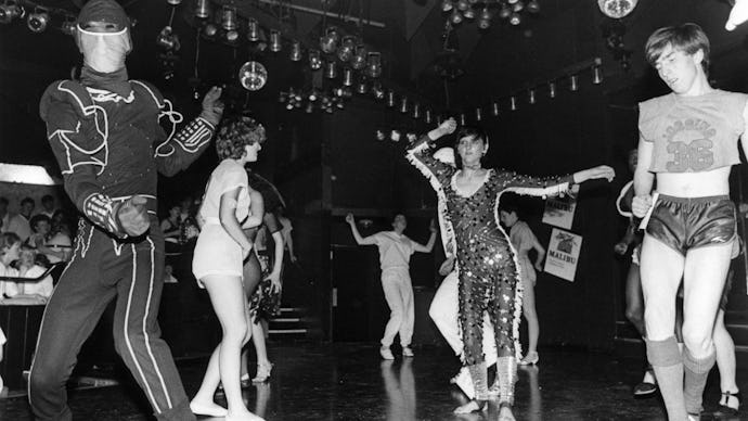 A group of people dancing in a photo taken in Studio 54