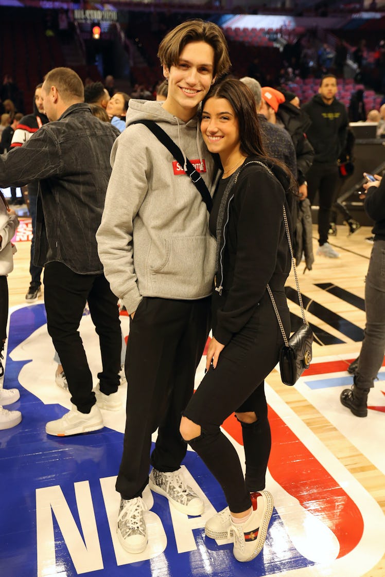 Chase Hudson and Charli C'Amelio attend an NBA game.