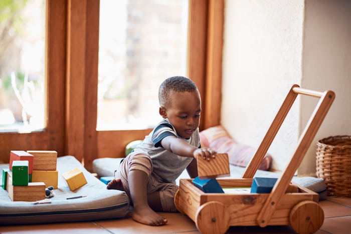 little boy playing with educational toys