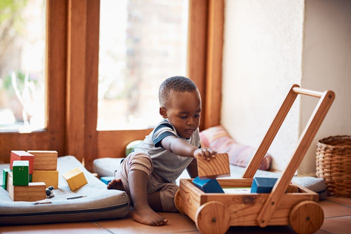 little boy playing with educational toys