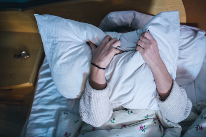 A tired mom wants to nap but her husband doesn't like it.