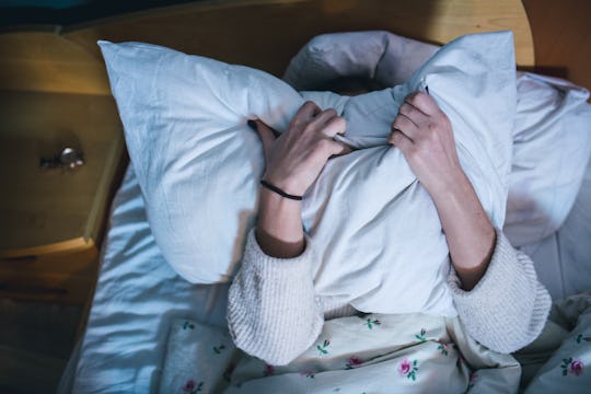 A tired mom wants to nap but her husband doesn't like it.