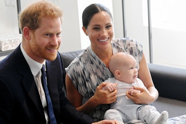 Meghan Markle and Prince Harry pose with their son Archie.