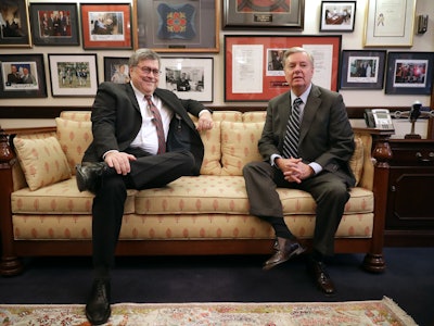 William Bar and Lindsey Graham sitting on a couch