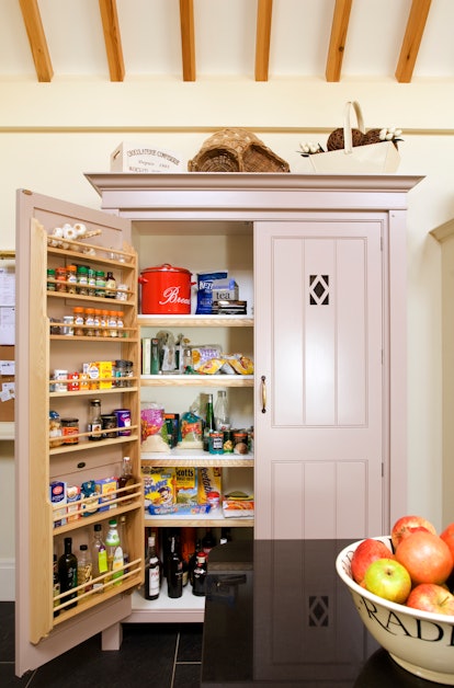 Your pantry door can be transformed into kitchen organizational shelving.