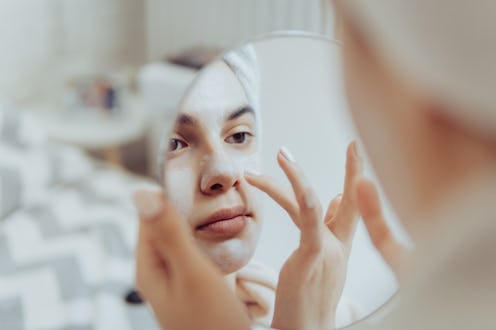 A young lady trying an esthetician-approved treatment by herself