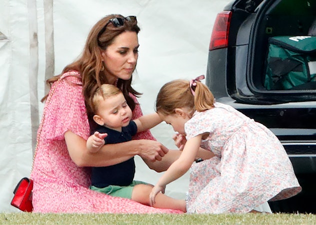 Prince Louis wants a hug from his sister.
