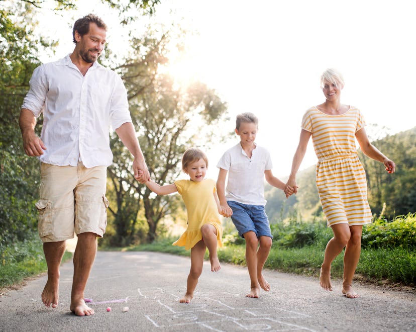 family playing hopscotch