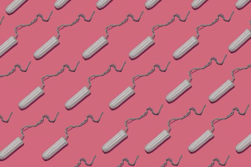 Plain tampons on a pink background. We asked an OB-GYN to debunk these toxic shock syndrome myths.