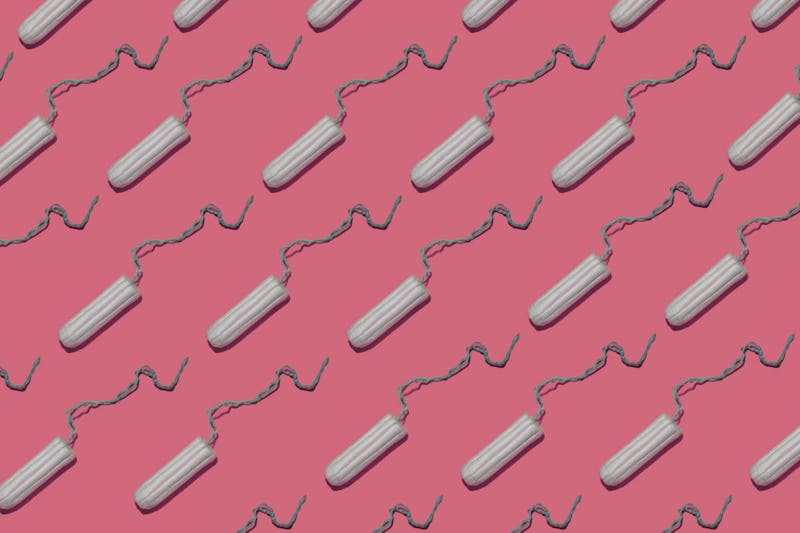 Plain tampons on a pink background. We asked an OB-GYN to debunk these toxic shock syndrome myths.