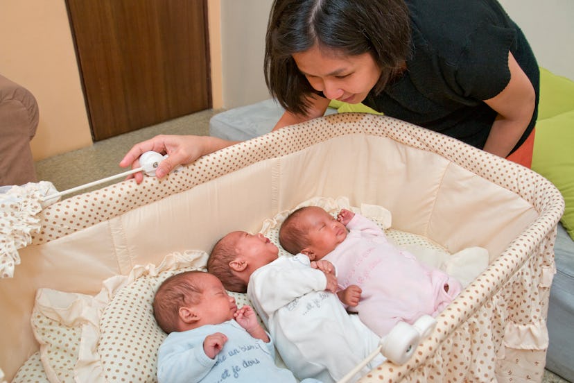 mom with triplets in crib, baby names for triplets