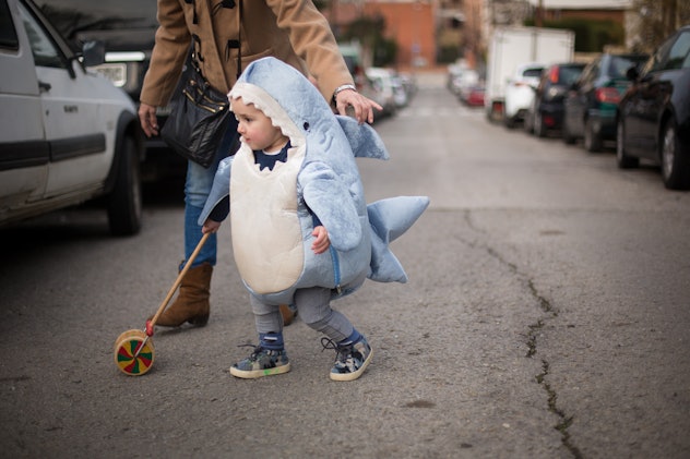 toddler wearing a shark costume 