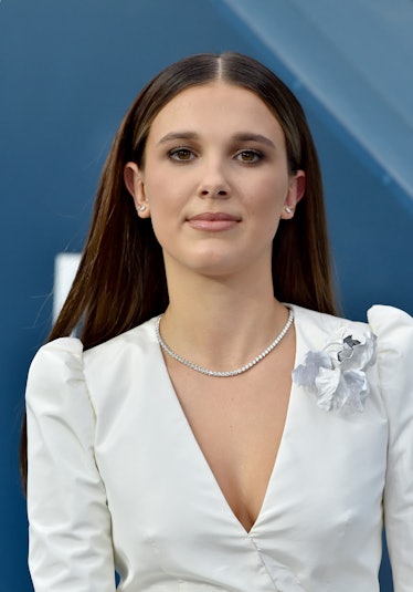 Millie Bobby Brown hits the red carpet in a white dress.