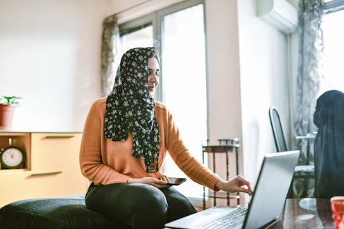 A woman uses zoom for a work meeting. If you use Zoom, you might be wondering if zoom is safe; a cyb...