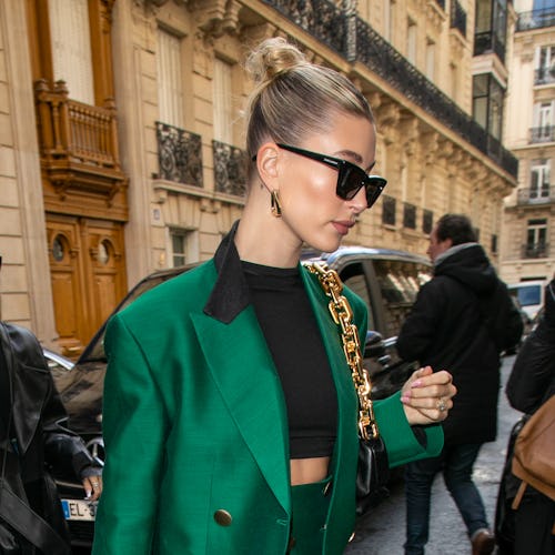 Hailey Baldwin knows how to sport an updo. Velvet scrunchies are one of several accessories she uses...