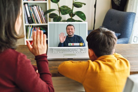 mom and son having zoom session with teacher