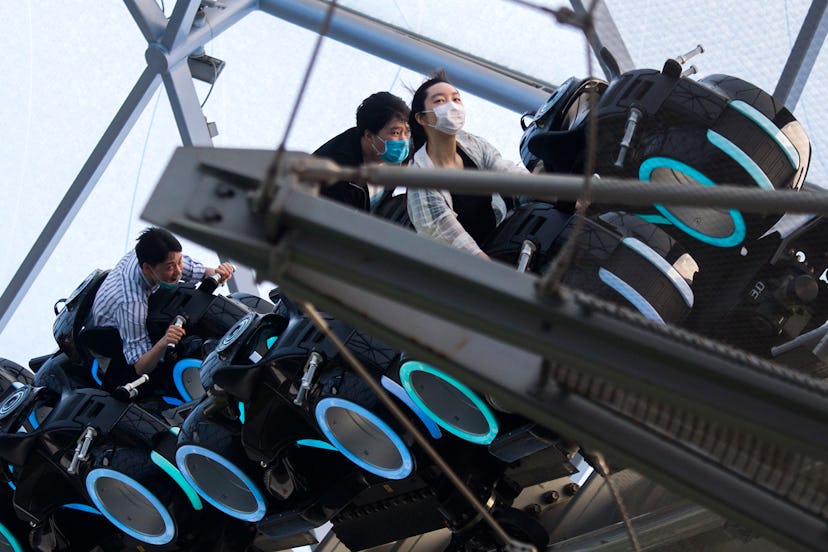 Guests wear mask as they ride rides 