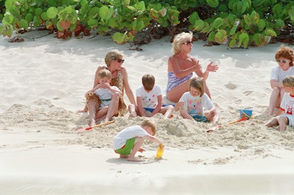 Princess Diana looks so happy on the beach with her family.