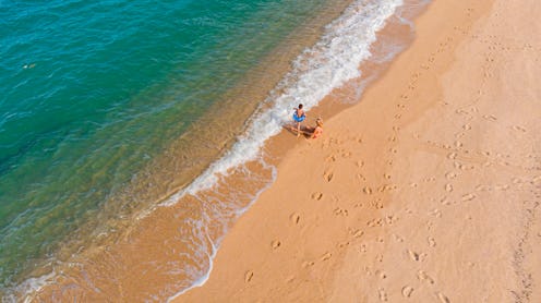 Two kids playing on an empty beach. How To Safely Go To The Beach During The Coronavirus Pandemic, A...