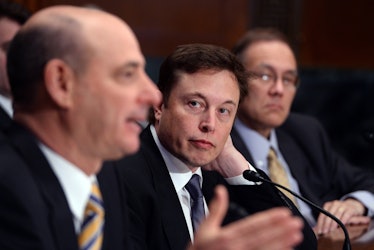 Elon Musk and then-ULA CEO Michael Gass testifying together at a Congressional hearing