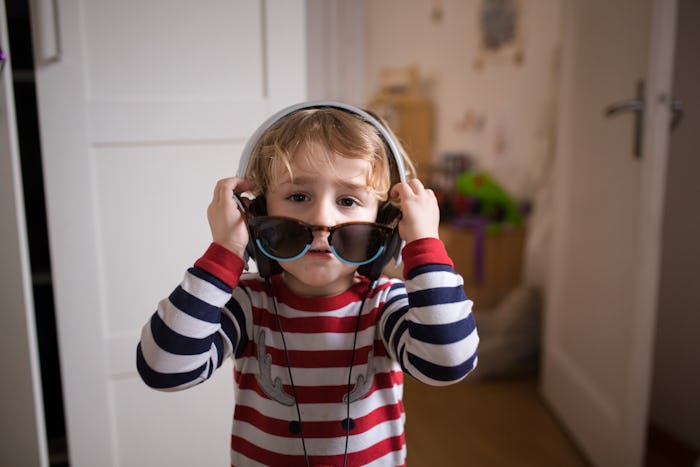 little boy wearing headphones and sunglasses