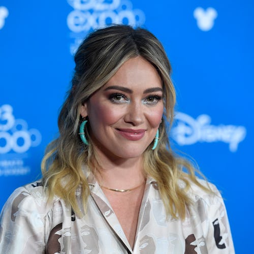 Hilary Duff's latest makeup tutorial features face crystals and an electric-blue cat-eye