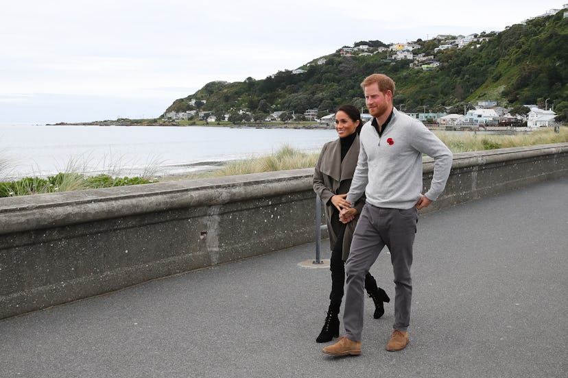 Prince Harry and Meghan Markle walk along the seaside