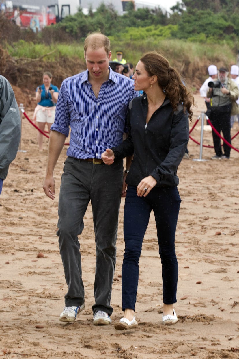 Prince William and Kate Middleton walk in the sand