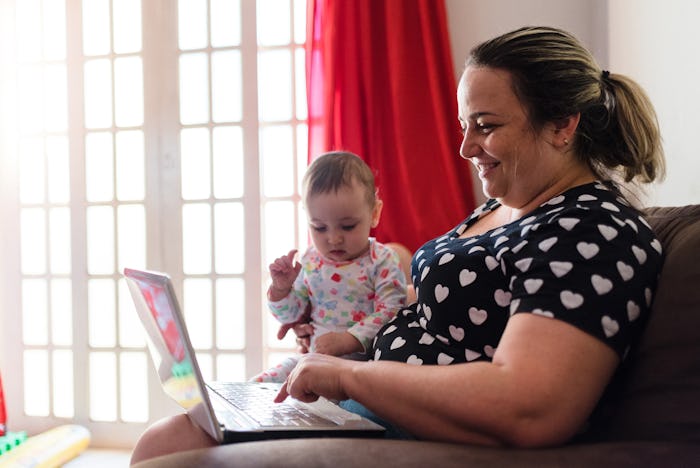 woman online shopping with baby