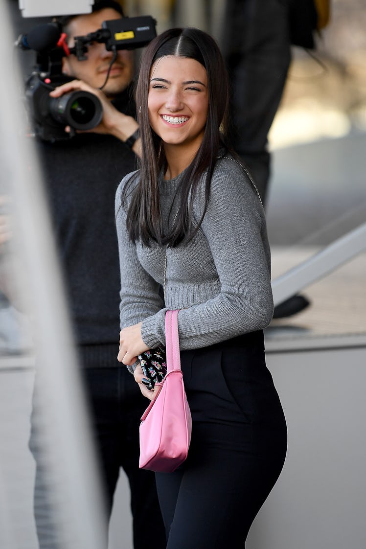 Charli D'Amelio flashes a smile.