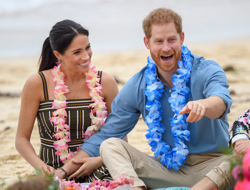 Prince Harry looks happy at the beach
