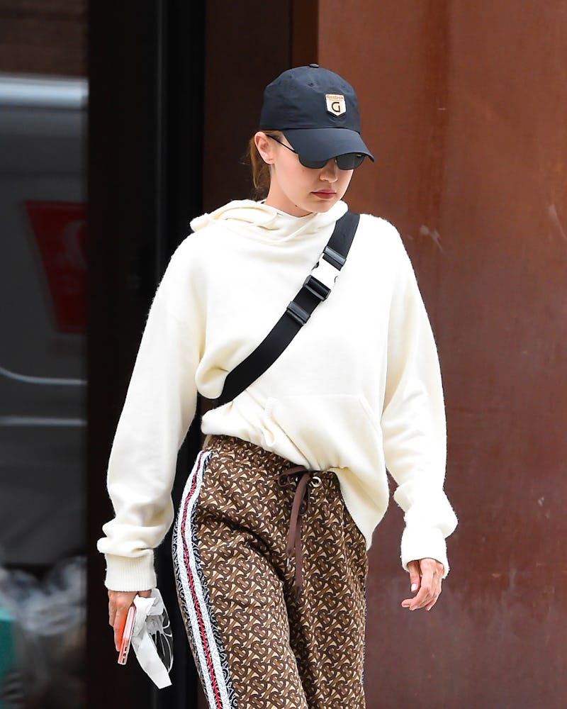 Gigi Hadid wearing a baseball hat.