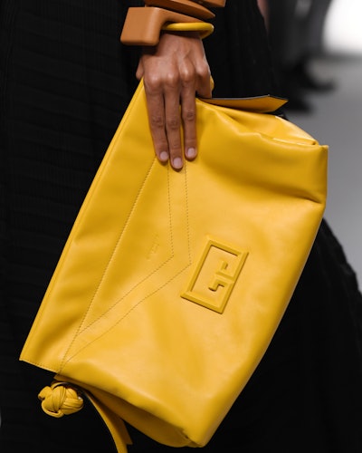 A model with a Givenchy SS20 bag, as one of the 4 Summer 2020 handbag trends you can invest in now a...