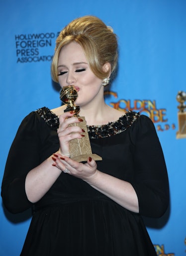 Adele poses with an award from the Hollywood Foreign Press Association.