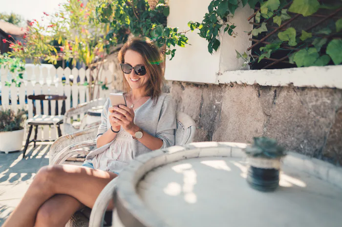 mom alone on phone outside