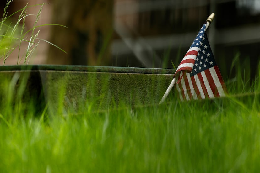 american flag in grass, it can be hard to find the right words to say to a veteran on memorial day 