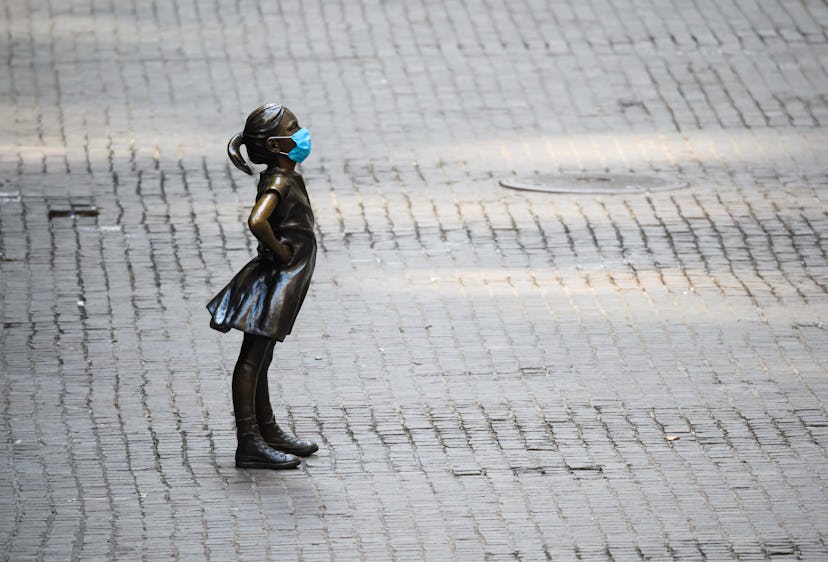 The famous Girl statue in New York wears a face mask. Face masks can make us more anxious but also h...