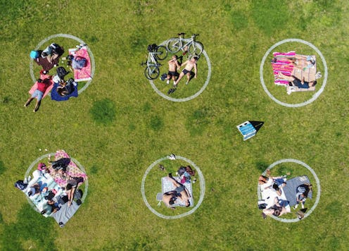 A park with social distancing circles. Talking to somebody who isn't respecting social distancing ru...