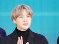 BTS' Suga waves to fans.