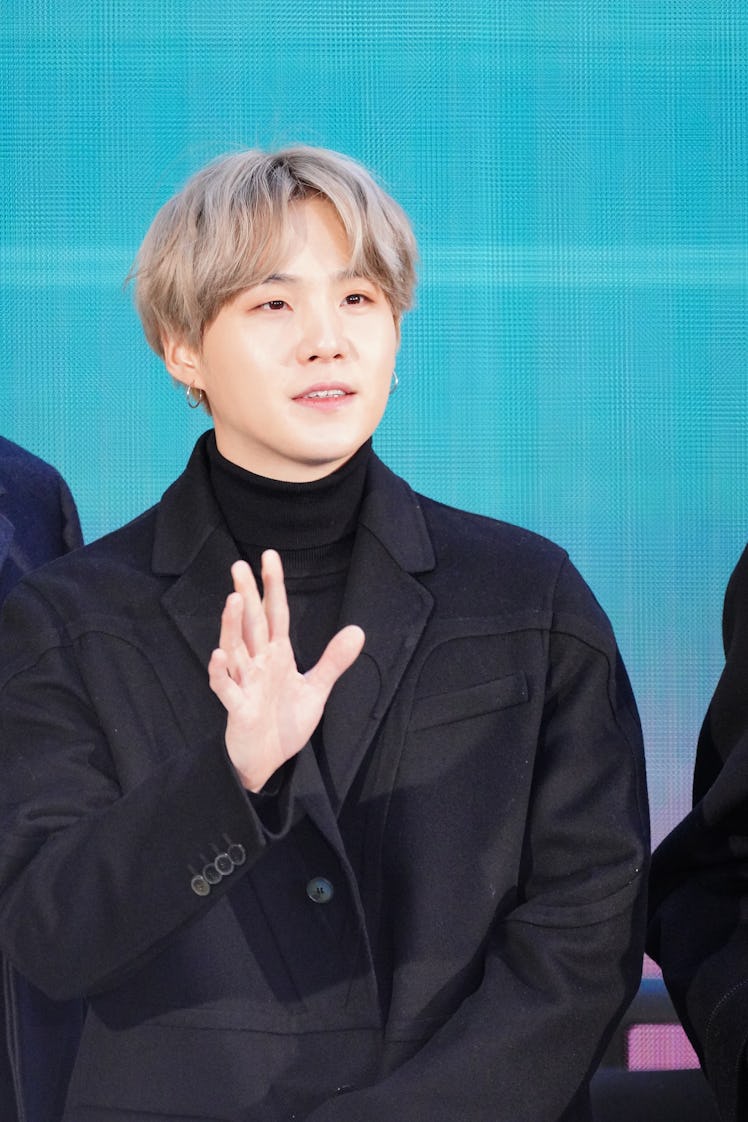 BTS' Suga waves to fans.