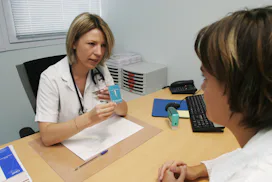 woman doctor explaining an IUD to a woman patient