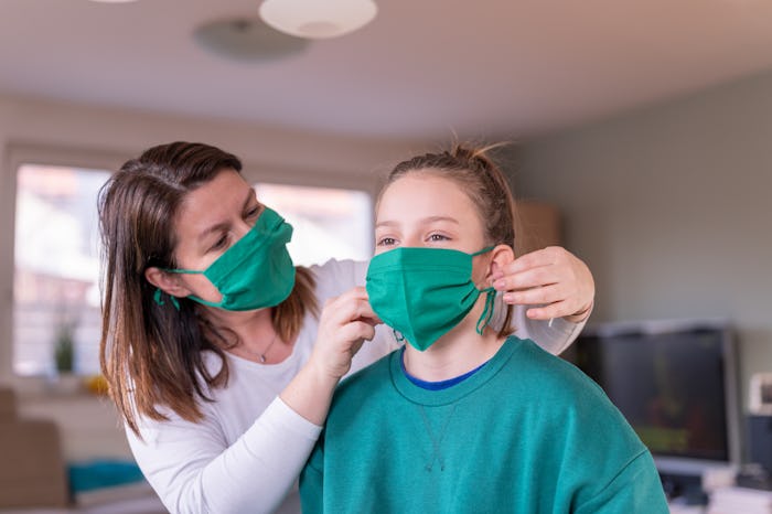 woman and daughter wearing cloth face masks