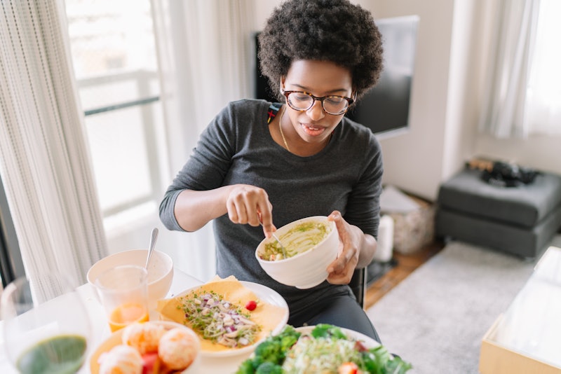 A woman cooking and balancing nutrients to boost your immune system