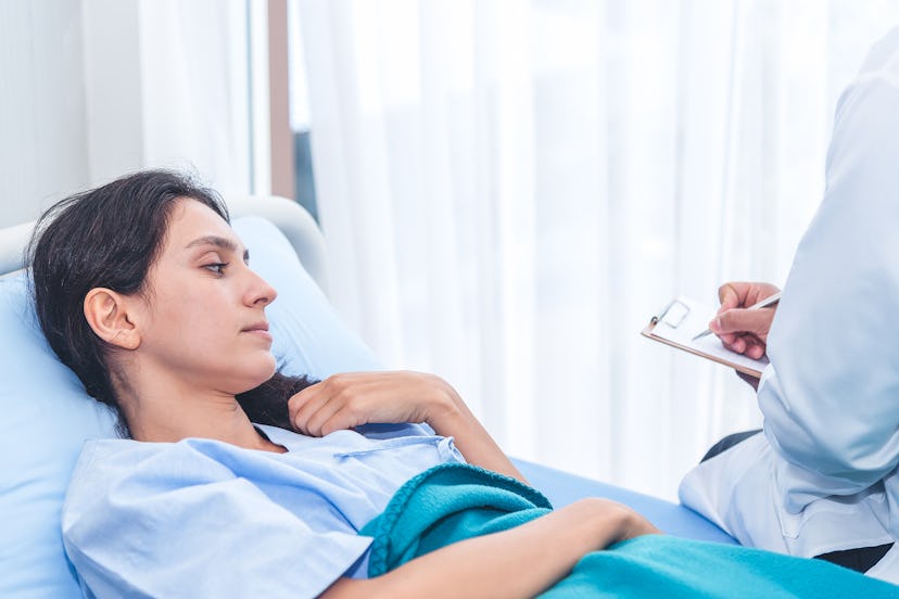 A woman with lyme disease lying down on a hospital bed