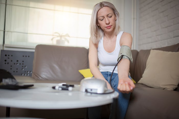 woman taking her blood pressure