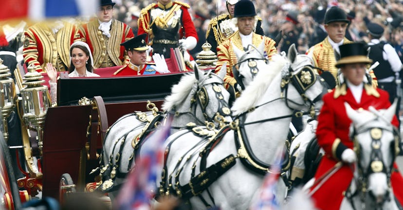 Prince William and Kate Middleton leave their wedding in a horse-drawn carriage.