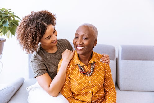 Daughter hugging her mother with Alzheimer's disease