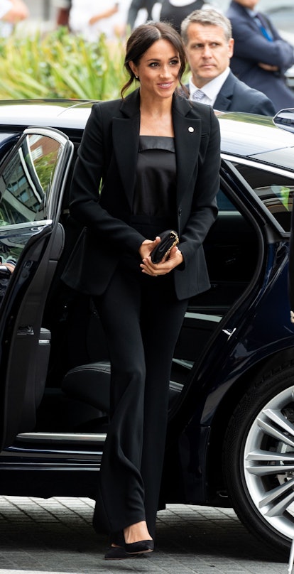 Meghan Markle wore a black silk camisole with a pantsuit for the WellChild Awards in 2018. 